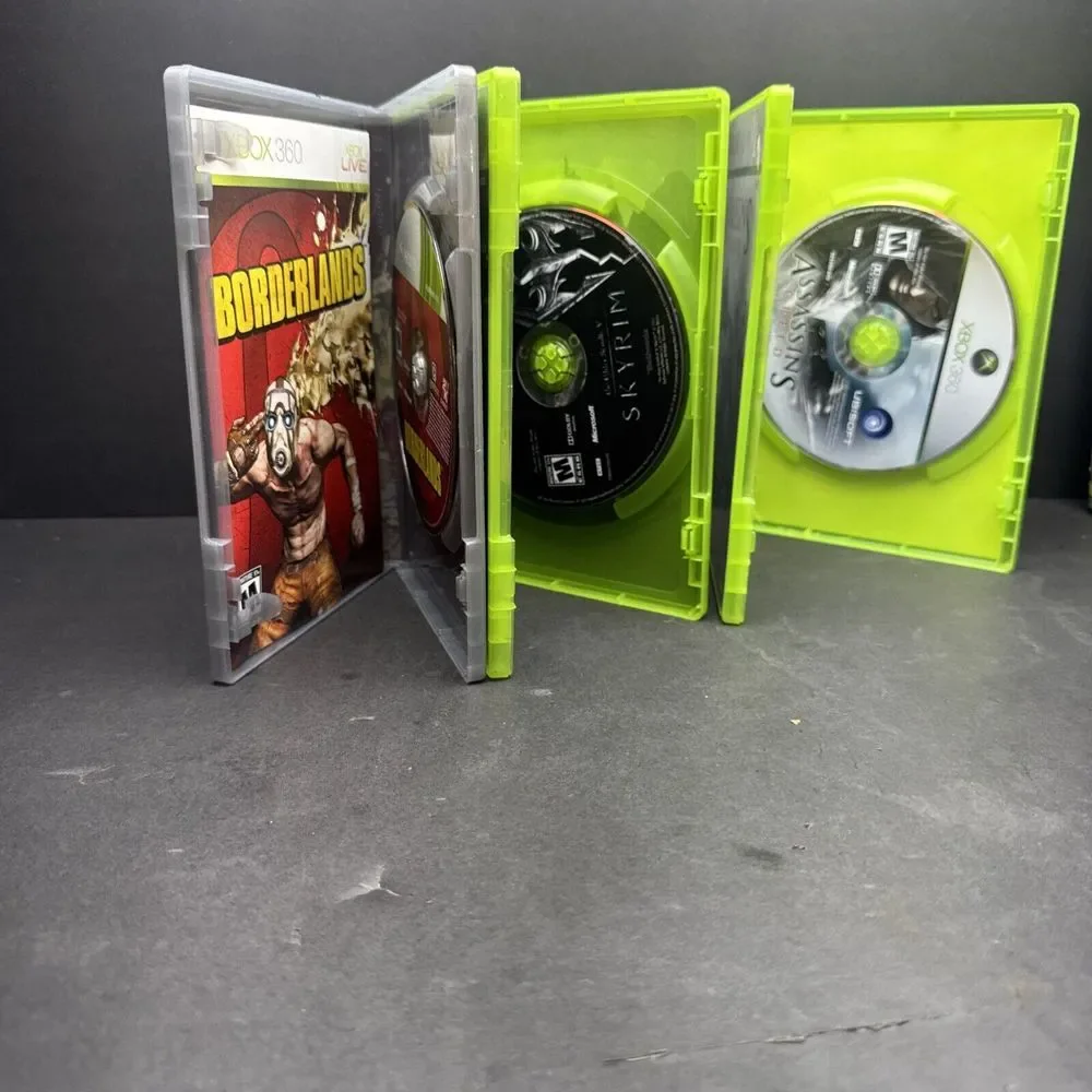 xbox  game lot Borderlands,‎ Assassin's Creed, Skyrim
